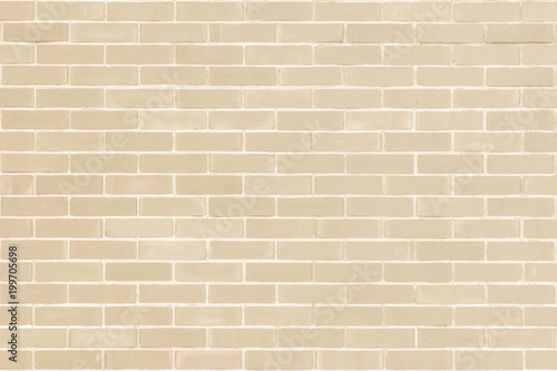 Brick wall texture pattern background in natural light ancient cream beige yellow brown color