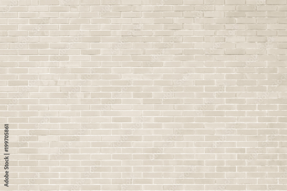 Fototapeta premium Brick wall texture pattern background in natural light cream beige brown color