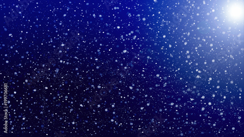 falling snow on background of blue sky