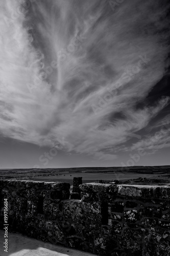 Stone Wall with Clouds