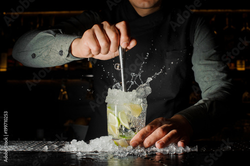 Sticker Bartender making cocktail at the bar counter