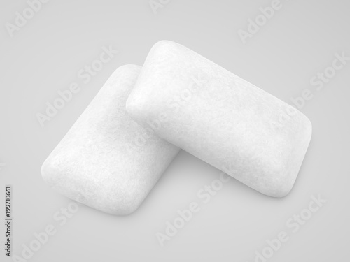 Two pieces of chewing gums on gray background with clipping path photo