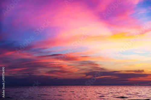 Tropical colorful dramatic sunset with cloudy sky . Evening calm on the Gulf of Thailand. Bright afterglow.