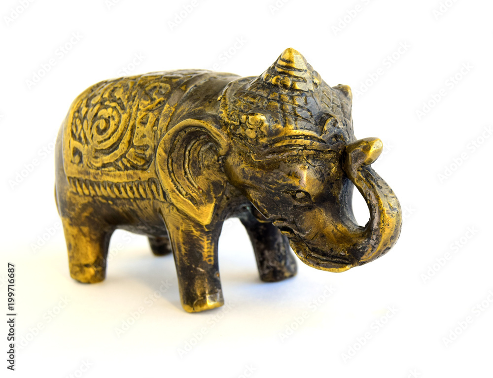 Naklejka premium The sculpture of an elephant is made of old bronze. The sculpture is located on a white background