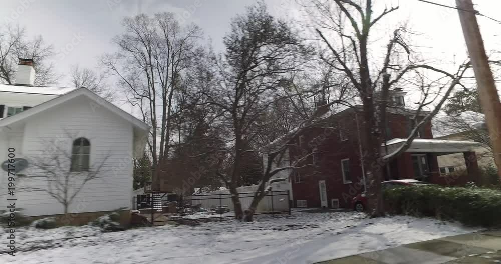 A driver's side perspective on the streets of an upscale residential neighborhood on a late winter day. Pittsburgh suburbs. A driver's side perspective on the streets of an upscale residential neighborhood on a late winter day. Pittsburgh suburbs.