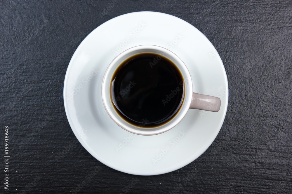 cup of coffee on black wooden background. Top view cup of coffee on black wooden background. Top view