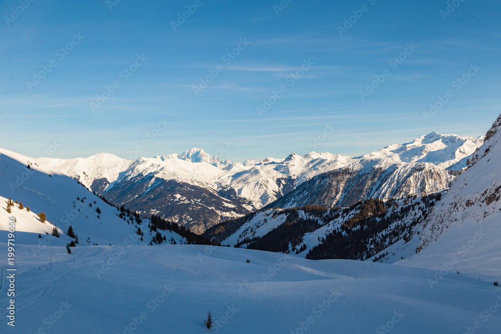 Alps winter landscape of slopes, off piste skiing, snowboarding in French resort of Courchevel, Les Trois Vallees , on a sunny day. France 2018.