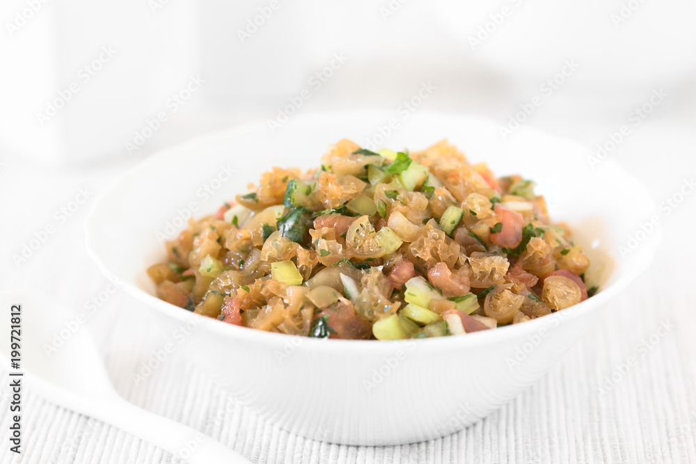 Chilean Pebre Salsa or Sauce made of Cochayuyo (lat. Durvillaea antarctica) or bull kelp seaweed, tomato, hot aji chili pepper, onion, garlic, parsley (Selective Focus in middle of the image) Chilean Pebre Salsa or Sauce made of Cochayuyo (lat. Durvillaea antarctica) or bull kelp seaweed, tomato, hot aji chili pepper, onion, garlic, parsley (Selective Focus in middle of the image)