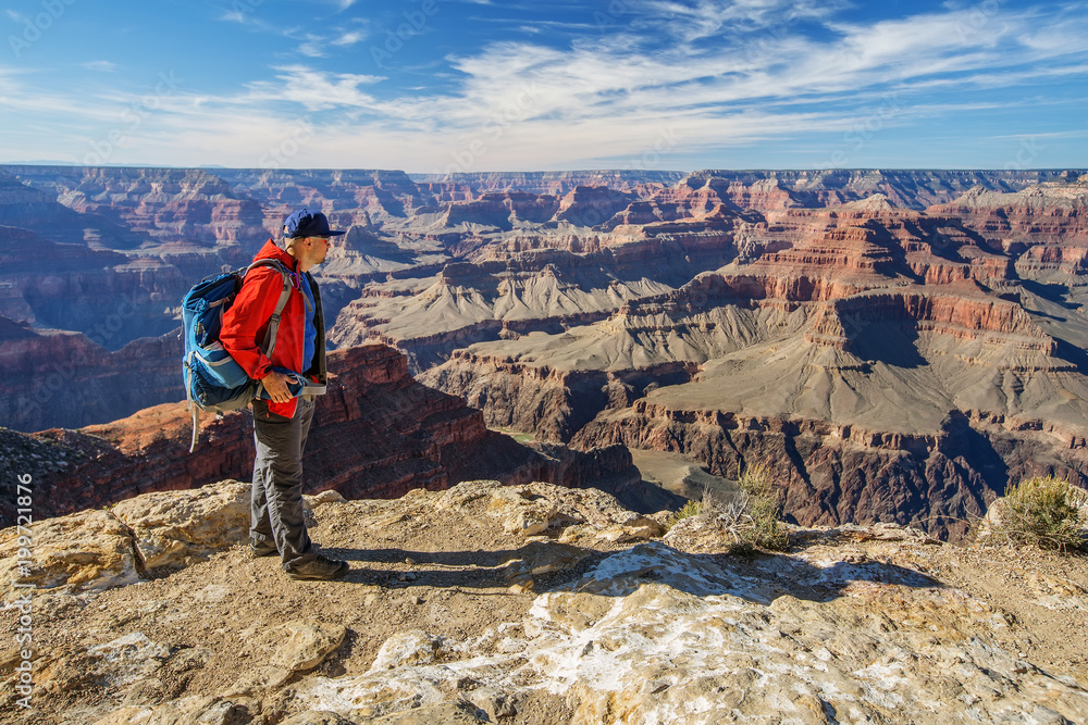 A hiker in the Grand Canyon National Park, South Rim, Arizona, USA A hiker in the Grand Canyon National Park, South Rim, Arizona, USA