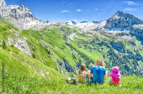 The family is on the verge of admiring the landscape of the Swiss peaks