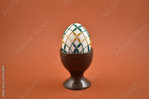 Wallpaper Mural Decorated easter egg stock images. Easter egg on a brown background. Spring decoration images. Simple ceramic egg stand. Crocheted Easter Egg. Easter concept Torontodigital.ca