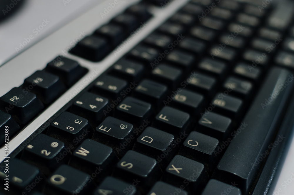 PC computer keyboard close up top side view working abstract background. Communication technology digital electronic device PC computer keyboard close up top side view working abstract background. Communication technology digital electronic device