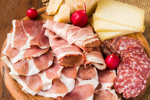 Tagliere di salumi, prosciutti e vari formaggi photo