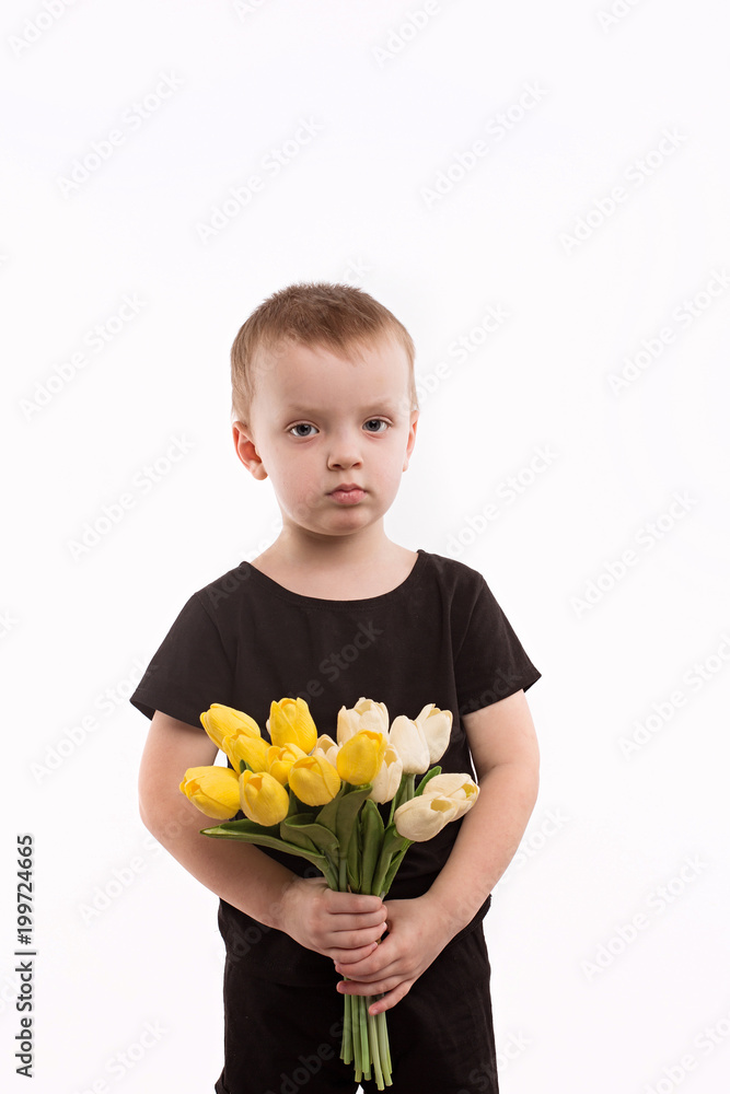 Young boy holding tulips isolated on white Young boy holding tulips isolated on white