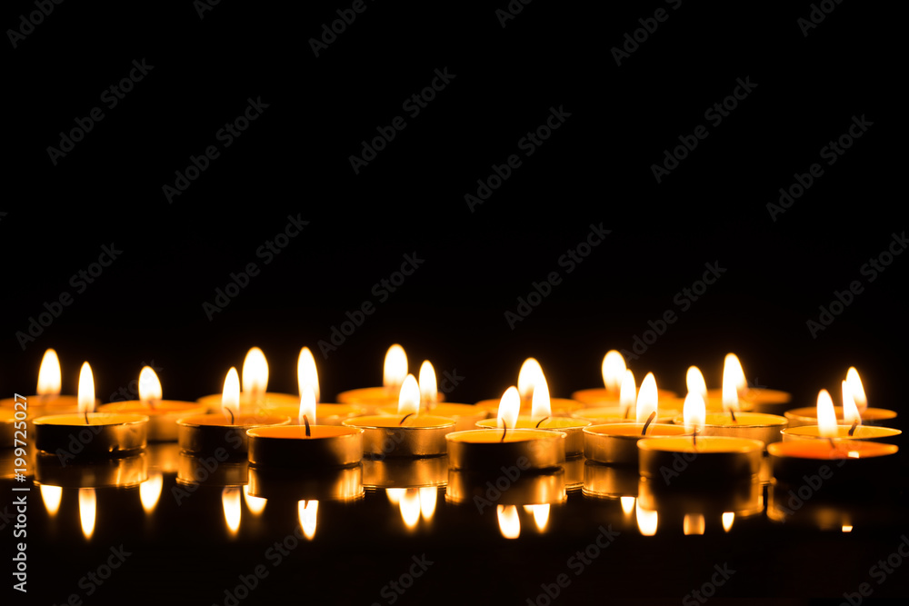 Candles in the dark with reflection and shallow depth of field Candles in the dark with reflection and shallow depth of field