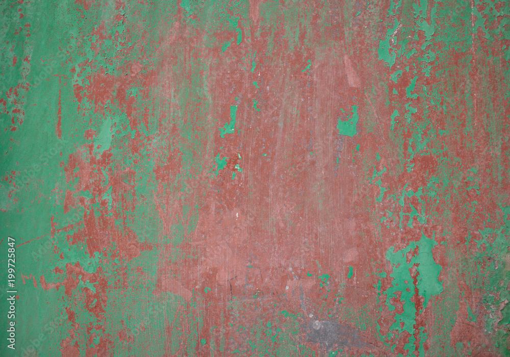 Weathered green red painted wall background partly faded