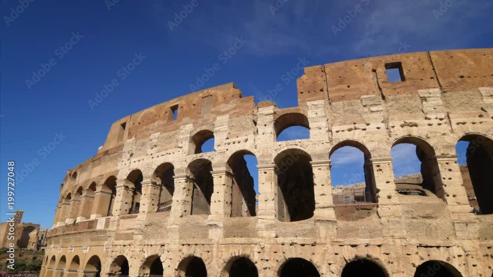 Roman Colosseum against a clear blue sky in Rome, Italy Roman Colosseum against a clear blue sky in Rome, Italy