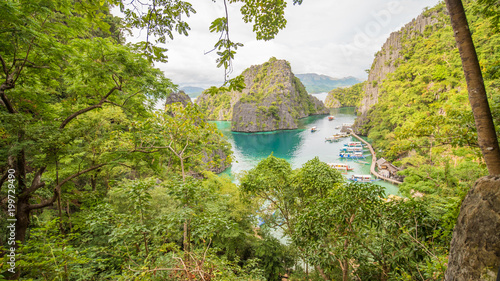 Very beautyful lagoon with boats. Paradise islands in Philippines. Kayangan Lake. Fisheye view. photo