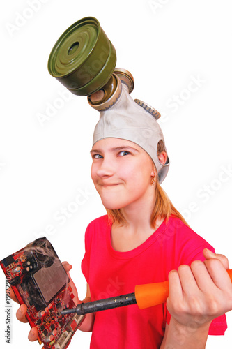 Obraz na płótnie A joke,a parody.The girl in the gas mask wants to burn a soldering iron broken video card. w salonie