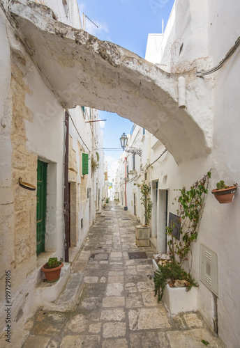 Fototapeta Naklejka Na Ścianę i Meble -  Ostuni (Puglia, Italy) - The gorgeous white city in province of Brindisi, Apulia region, Southern Italy, with the old historic center on the hill and beside the sea