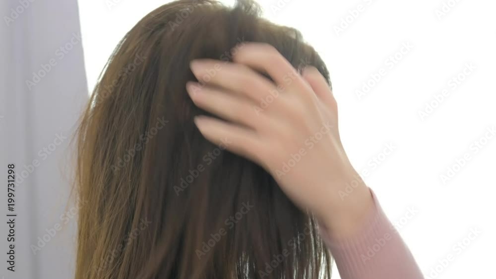 Portrait of young beautiful woman touch hairs in make up salon Portrait of young beautiful woman touch hairs in make up salon