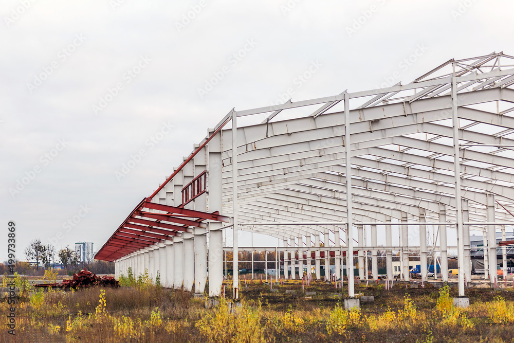  Construction site. Metal structure frame of industrial building 