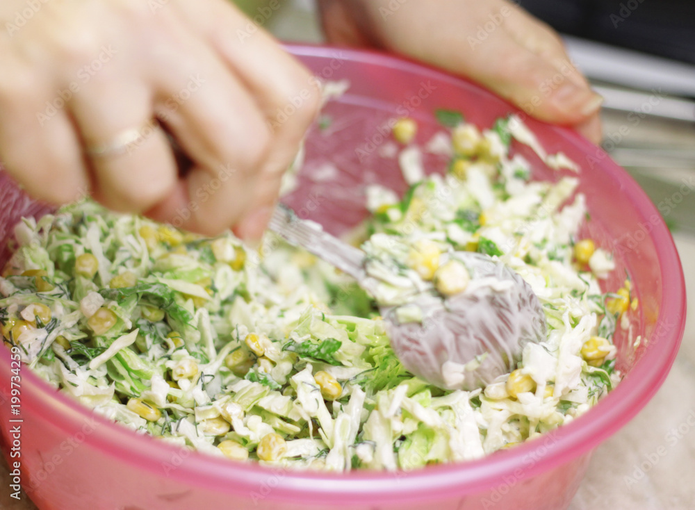 Fresh salad with canned corn, cabbage and parsley
