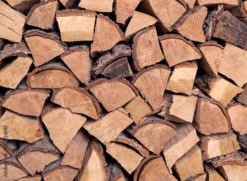Huge pile of cut wood stump log texture used as background