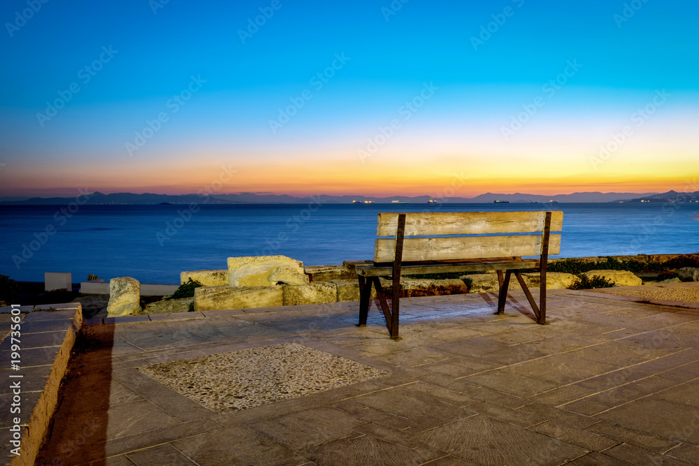 Bench view to the sea and sunset