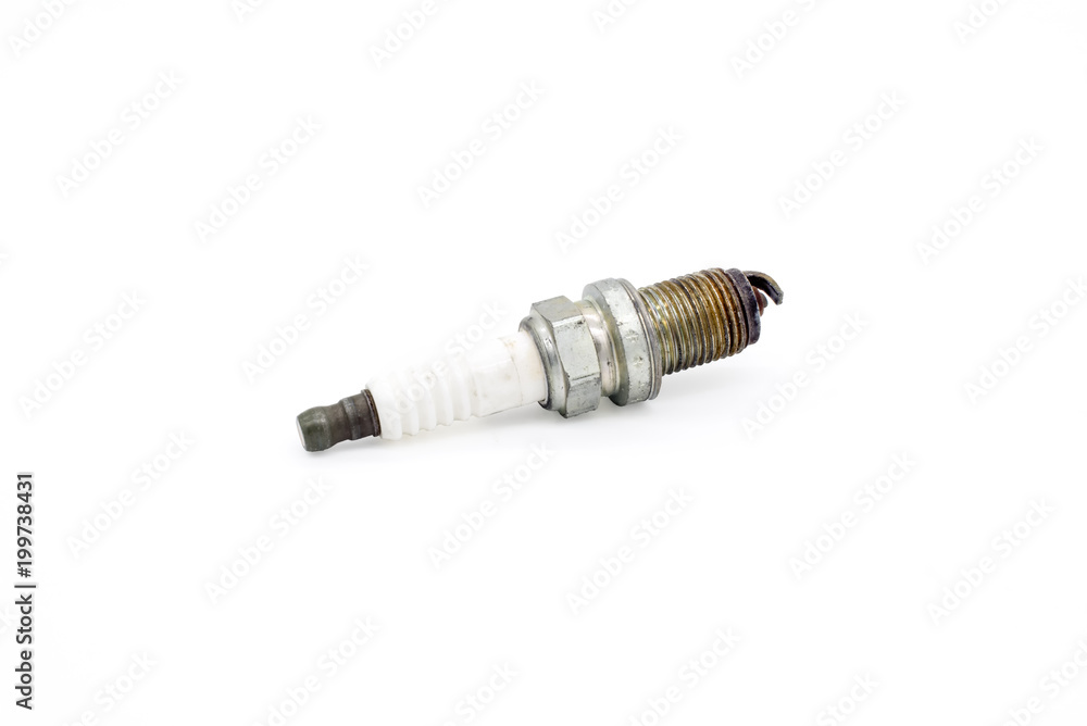 Old spark plug isolated on the white Old spark plug isolated on the white