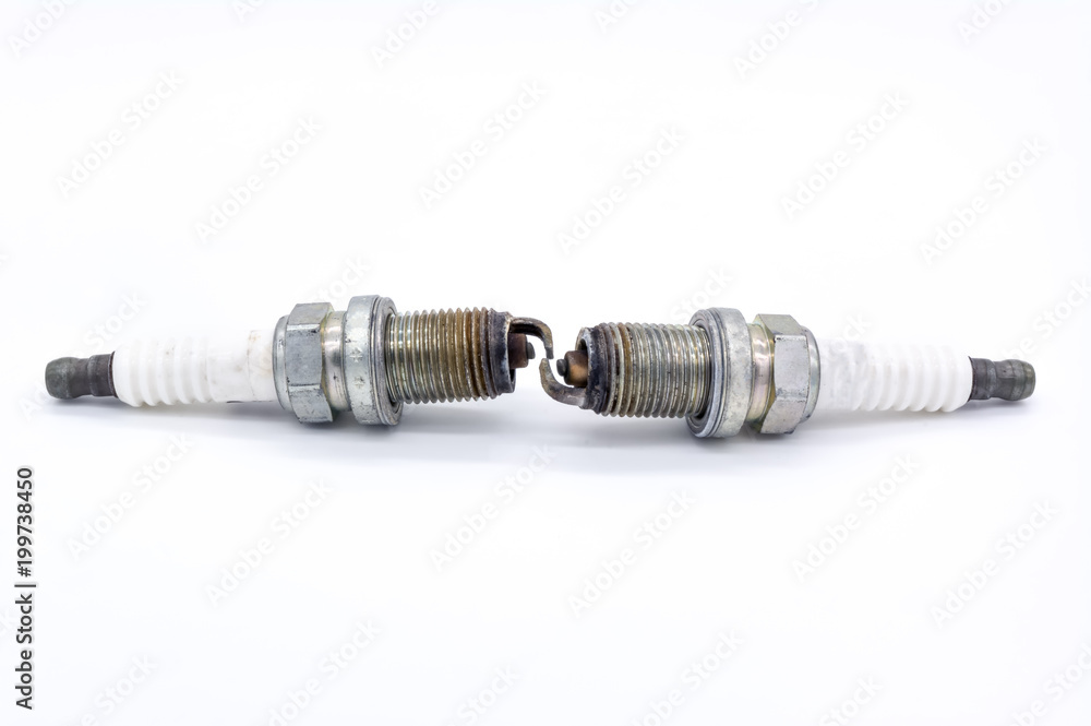 Old spark plug isolated on the white Old spark plug isolated on the white