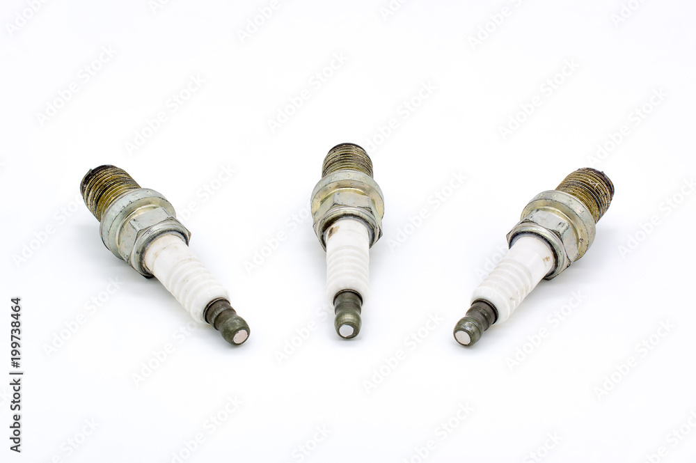 Old spark plug isolated on the white Old spark plug isolated on the white