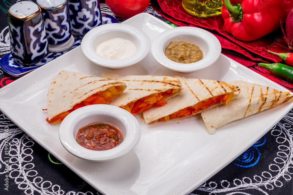 Quesadilla with chicken and sauces Quesadilla with chicken and sauces