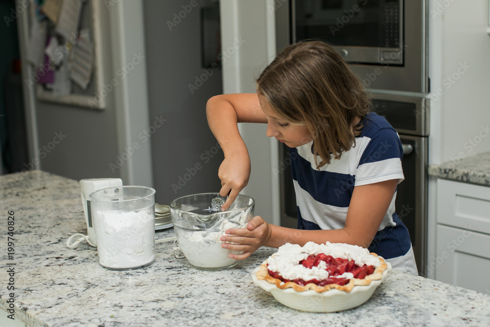 Little Girl Making Dessert with Grandmother in Modern Kitchen Little Girl Making Dessert with Grandmother in Modern Kitchen