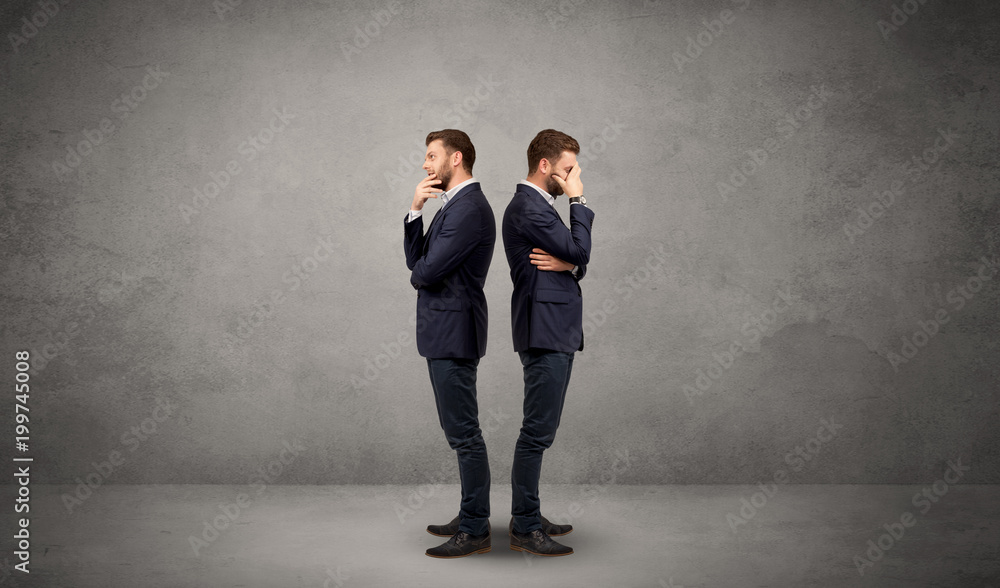 Young conflicted businessman choosing between two directions Young conflicted businessman choosing between two directions