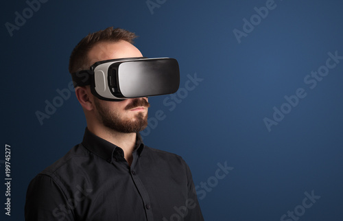 Amazed businessman with virtual reality goggles  © ra2 studio