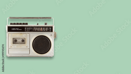 Radio cassette recorder and player on color background. retro technology. flat lay, top view hero header. vintage color styles. photo