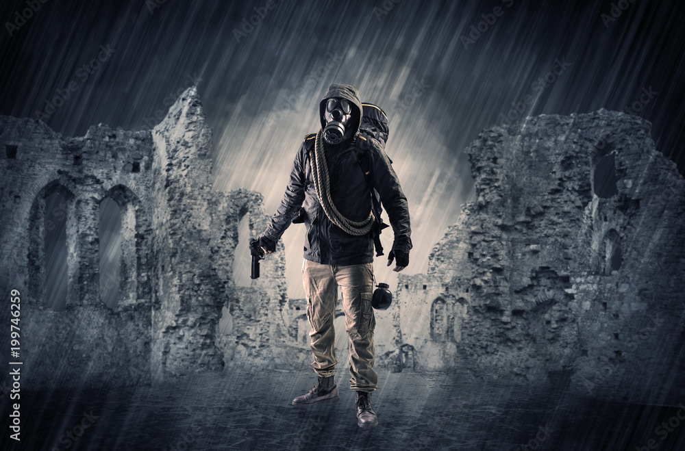 Fototapeta premium Hazard, menace man in a ruined crumbly building with arms on his hand 