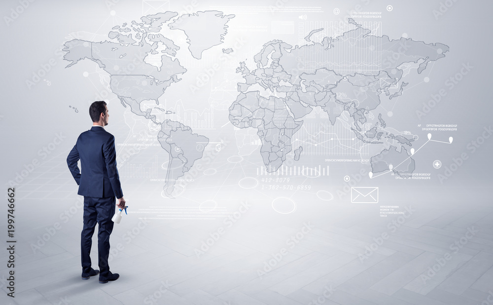 Businessman standing with his back and looking at a worldwide map with objects in his hand
Businessman standing with his back and looking at a worldwide map with objects in his hand