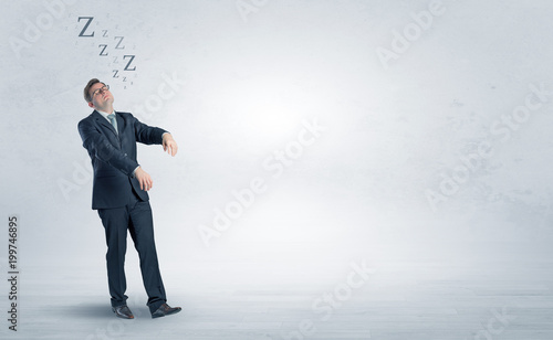 Tired businessman with sleeping sickness going somewhere
