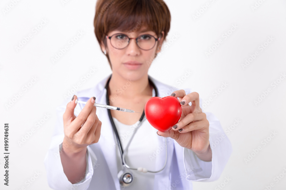 Doctor vaccination to the red heart. Isolated on white background. Studio lighting. Concept for healthy and medical Doctor vaccination to the red heart. Isolated on white background. Studio lighting. Concept for healthy and medical