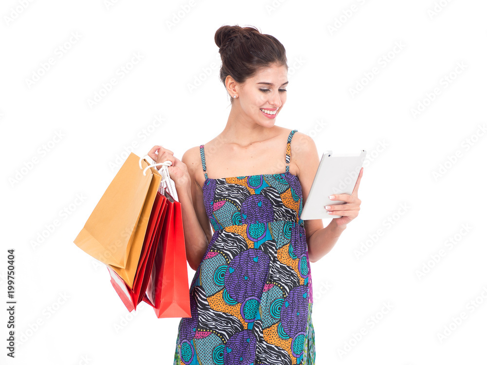 Picture showing pretty woman shopping online with smart tablet.Portrait of young happy smiling woman with shopping bags. Picture showing pretty woman shopping online with smart tablet.Portrait of young happy smiling woman with shopping bags.