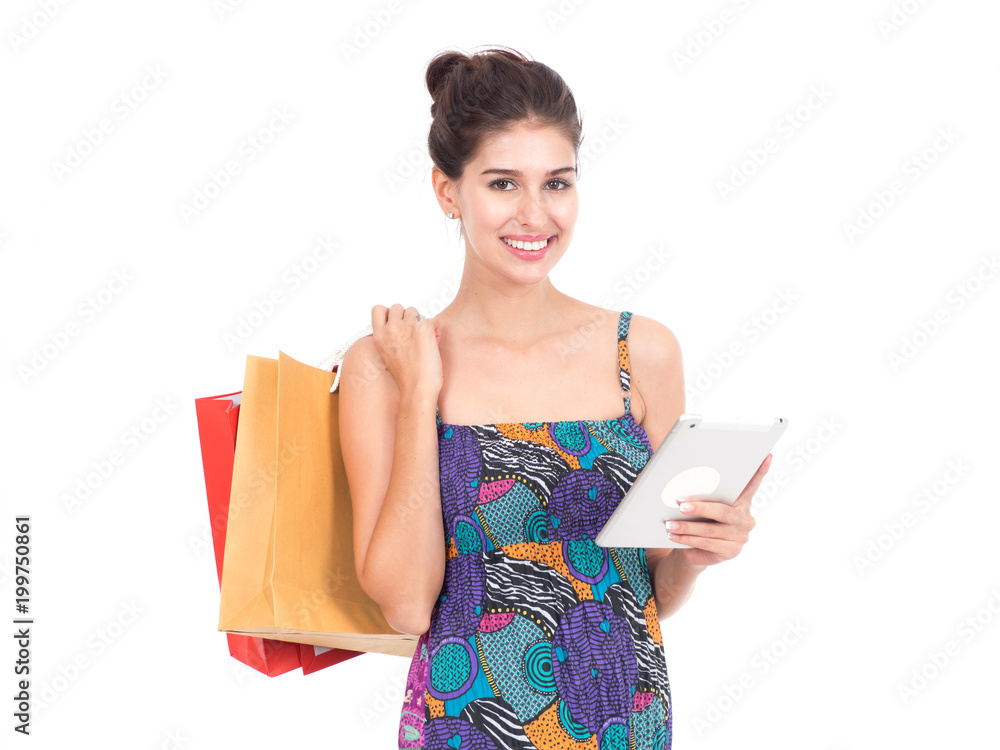 Picture showing pretty woman shopping online with smart tablet.Portrait of young happy smiling woman with shopping bags. Picture showing pretty woman shopping online with smart tablet.Portrait of young happy smiling woman with shopping bags.