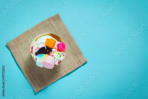 Homemade cupcake on blue background
