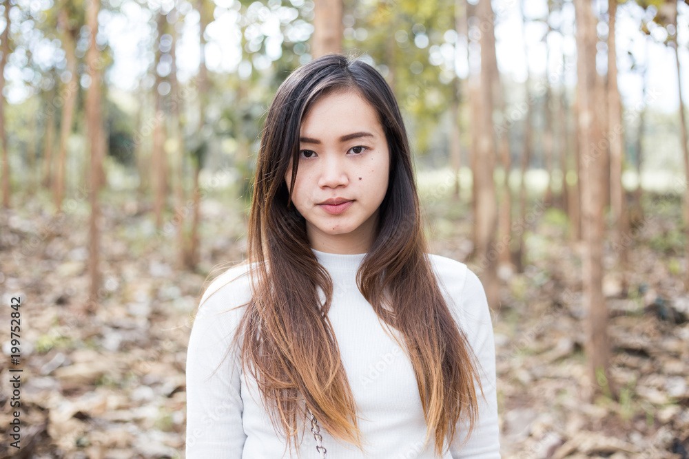 Hipster indy asian women stading in park forest Hipster indy asian women stading in park forest