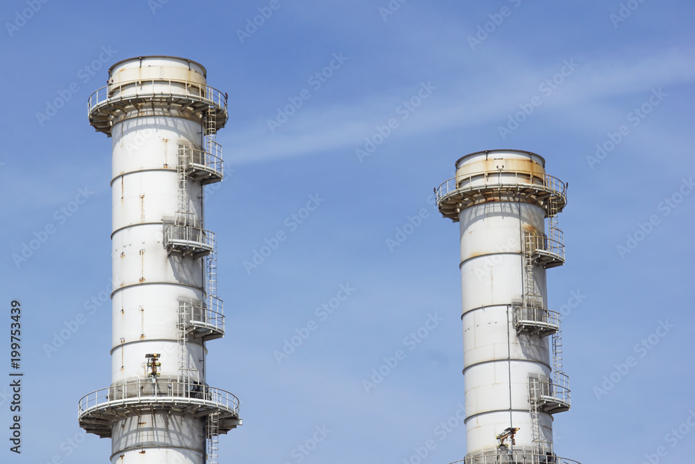 Pipes of industrial factory and blue sky background Pipes of industrial factory and blue sky background