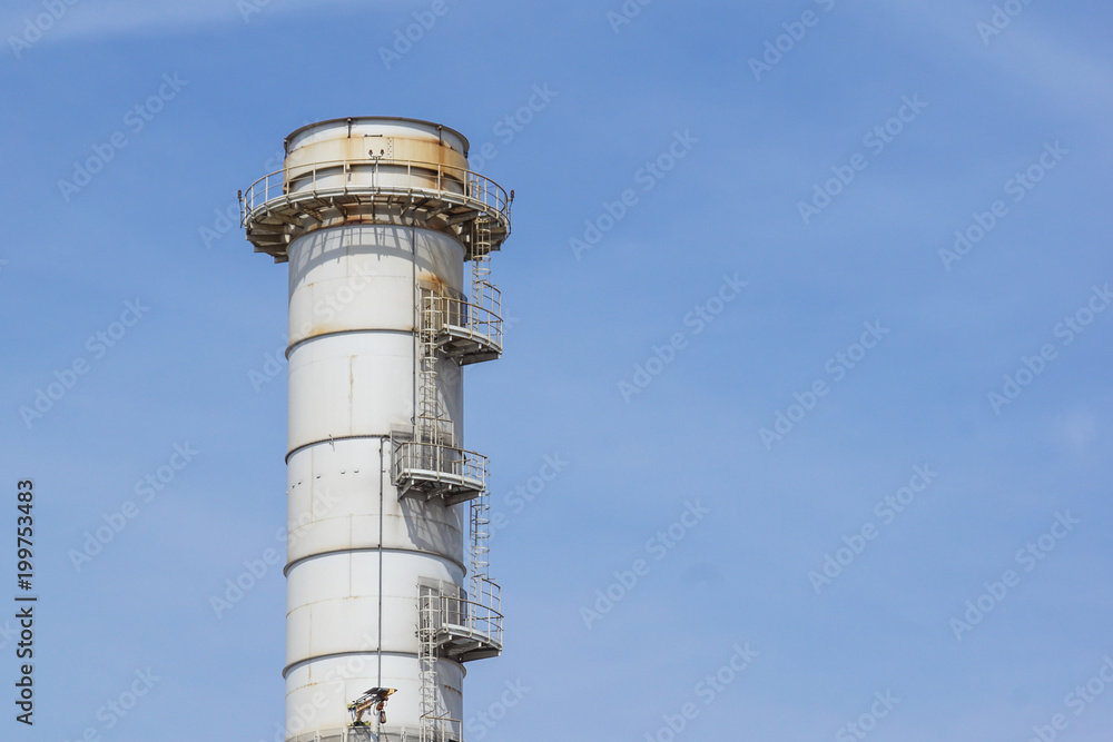 Pipes of industrial factory and blue sky background Pipes of industrial factory and blue sky background
