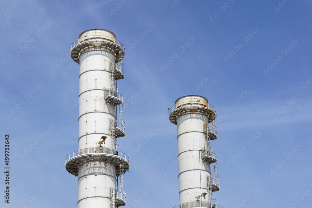 Pipes of industrial factory and blue sky background Pipes of industrial factory and blue sky background