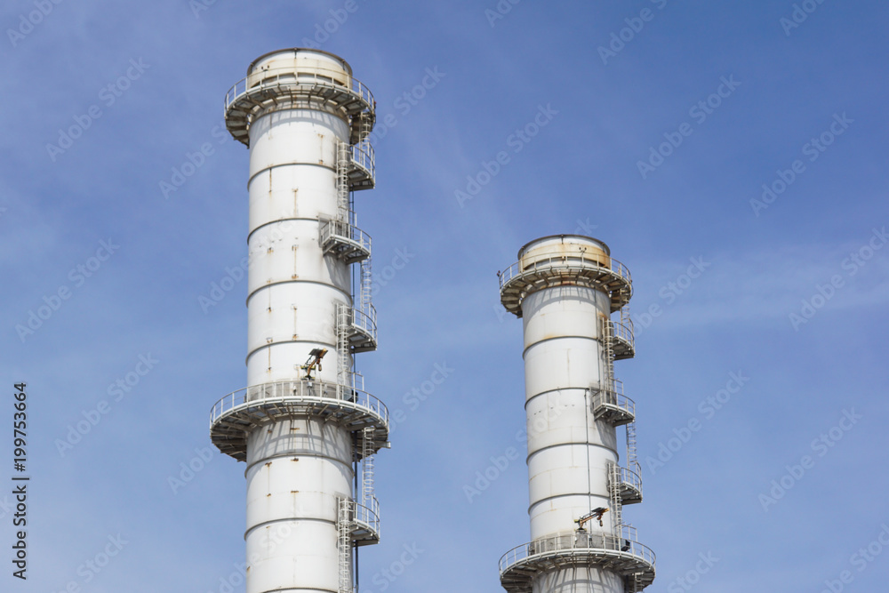 Pipes of industrial factory and blue sky background Pipes of industrial factory and blue sky background