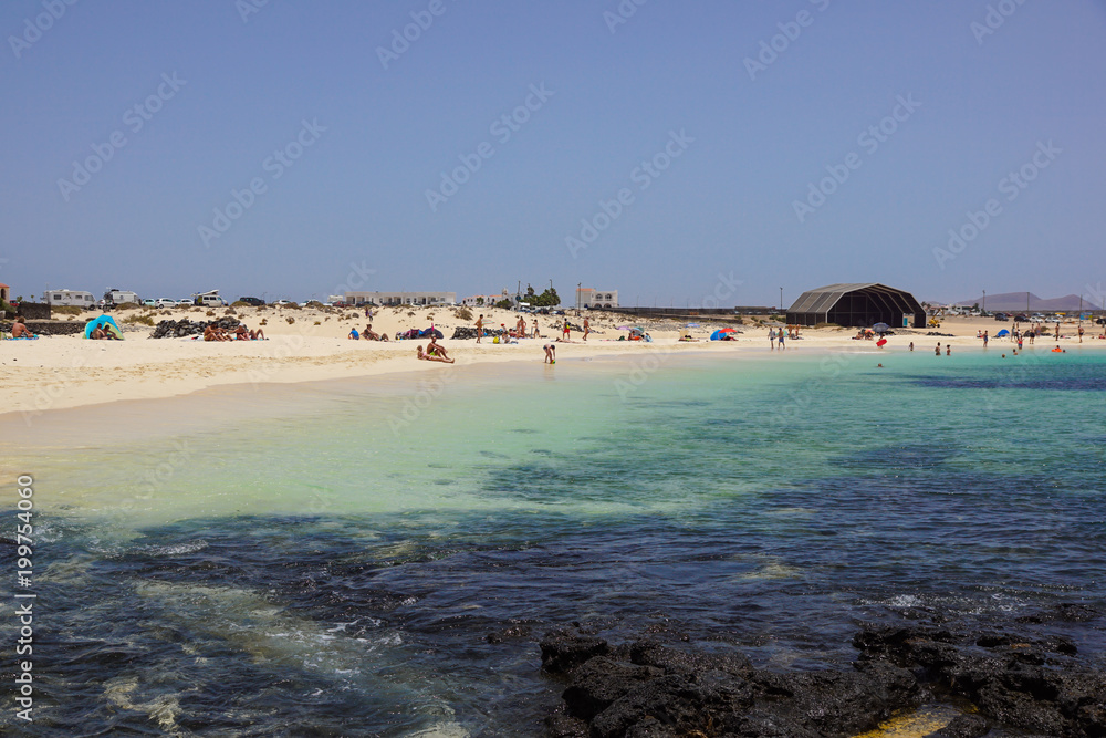 View on famous beach Playa de Jandia - Playa de Sotavento - Playa Lagoon on the Canary Island Fuerteventura, Spain. This beach belongs to the best beaches in the world for windsurfing.
